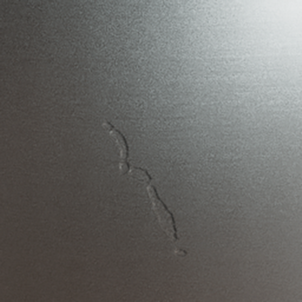 metallic_comp_crack_1 Metallic surface sample with synthetic crack defect for AI-powered quality inspection dataset.